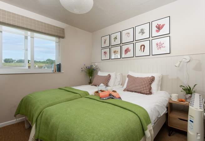 Beautiful bedroom two with three-foot single beds.