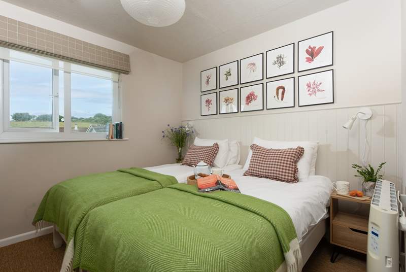 Beautiful bedroom two with three-foot single beds.