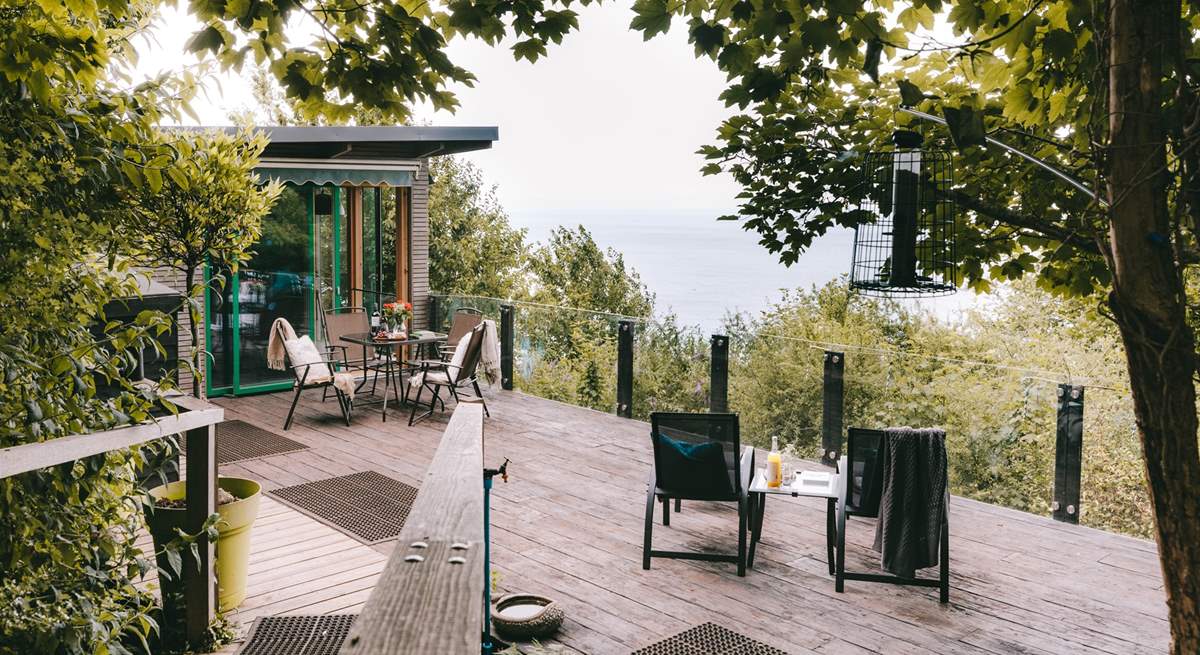 Wander through the trees and arrive at your romantic clifftop cabin.