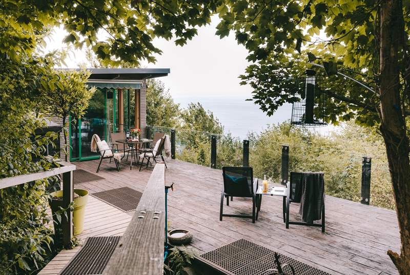 Wander through the trees and arrive at your romantic clifftop cabin.