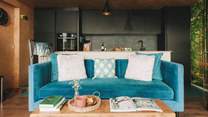Snuggle into the soft velvet sofa.