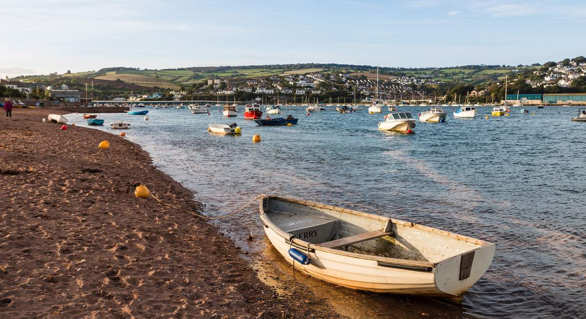 Watch little boats come and go on the sandy shore of Shaldon.