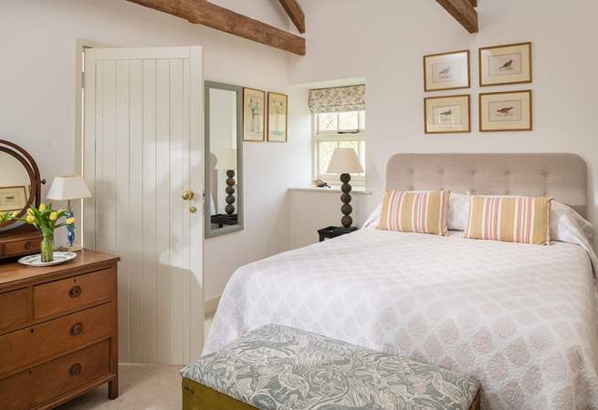 A comfy king-size bed, with beautiful, country styling.