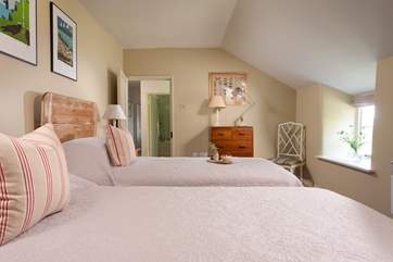 The sloping ceiling adds to the character of bedroom one.