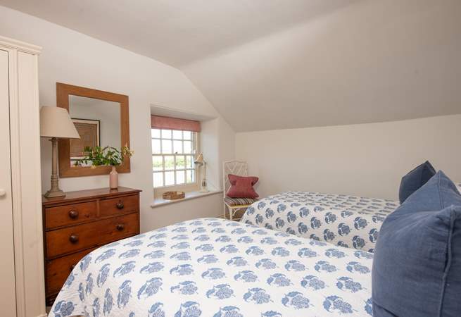 Twin beds await in the fourth bedroom.