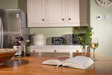 Gather around the kitchen island as meals are being prepared.