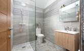 You have a fabulous large walk-in shower to wash away sandy toes and salty hair.  - Thumbnail Image