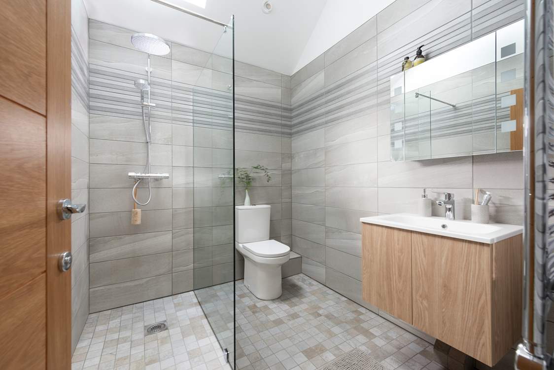 You have a fabulous large walk-in shower to wash away sandy toes and salty hair.