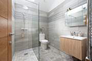 You have a fabulous large walk-in shower to wash away sandy toes and salty hair.