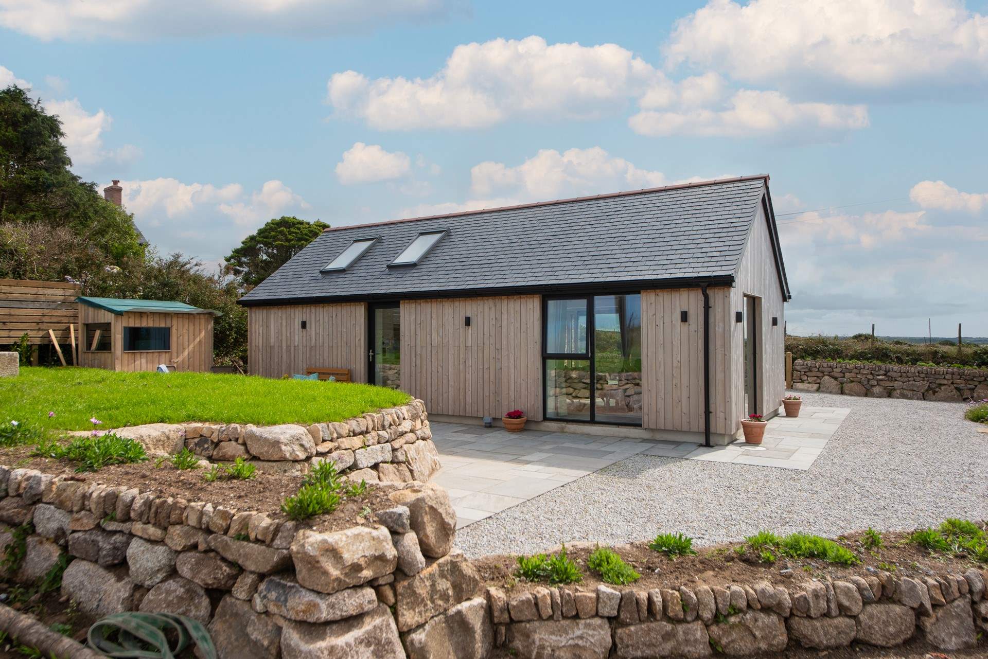 Walk out of the kitchen door onto the sheltered patio area.