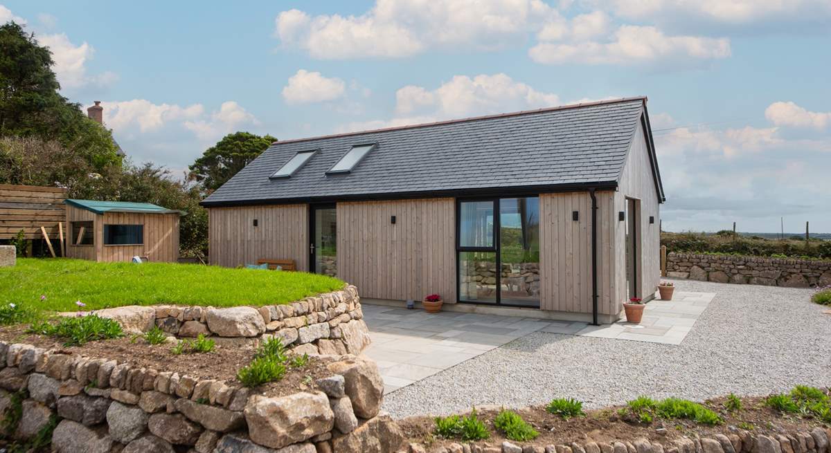 Walk out of the kitchen door onto the sheltered patio area.