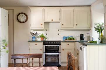 Traditional blue and white Cornishware complements the country-style kitchen.