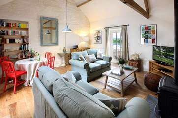 The cosy sitting-area with comfy sofas and wood-burner.