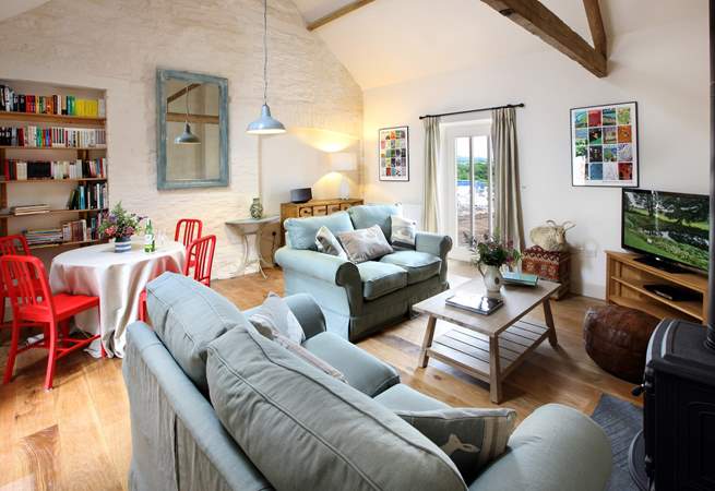 The cosy sitting-area with comfy sofas and wood-burner.