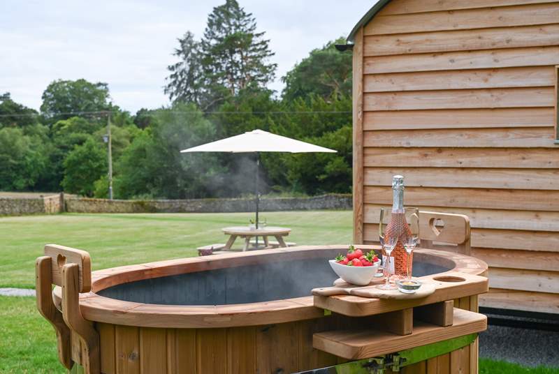 Soak your worries away in the steamy wood-fired hot tub.