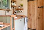 The sweet kitchen area has everything you'll need during your glamping getaway.