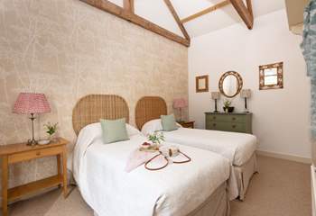 Two charming bedrooms await at this lovely courtyard cottage.