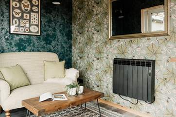 The sweet sofa is just the spot to get cosy with a morning cuppa.
