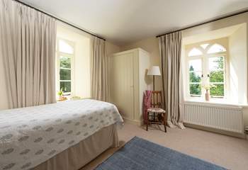 This beautiful bedroom is also double aspect which really lets the outside in.