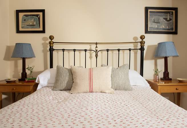 Snuggle up under the covers in the comfy king-size bed in Bedroom 1.