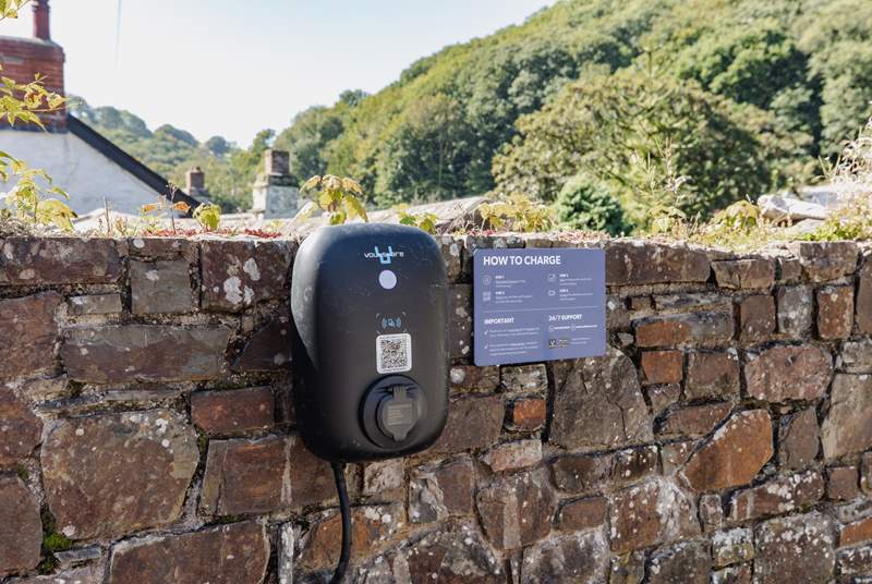 You will find the EV car charging point on the wall.