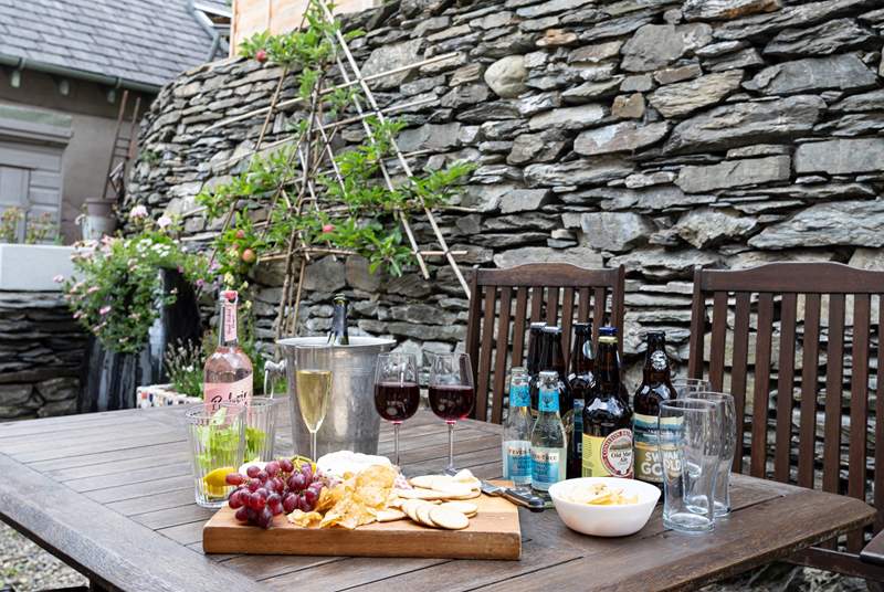 The lovely courtyard with Lakeland slate walls is just the place for outdoor dining.