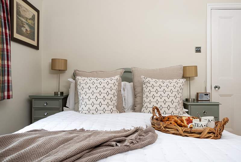 Bedroom five is decorated in a calm and relaxing style with an en suite shower-room.