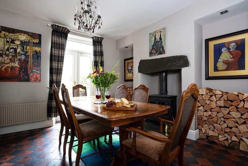 The dining-room has doors out to the rear courtyard and a cosy wood-burner for out-of-season breaks.