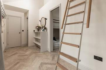 You'll find both bedrooms and the shower-room to the left of the hideaway.