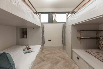 The second bedroom has a 4'3'' lower bunk with 3' bunk above plus a seating area with 3' bunk above, perfect for younger guests.