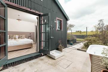 You'll find the outside bathtub and al fresco shower just outside the main bedroom.