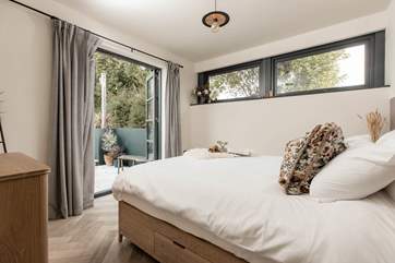 The main bedroom is light and spacious, and boasts a king-size bed.