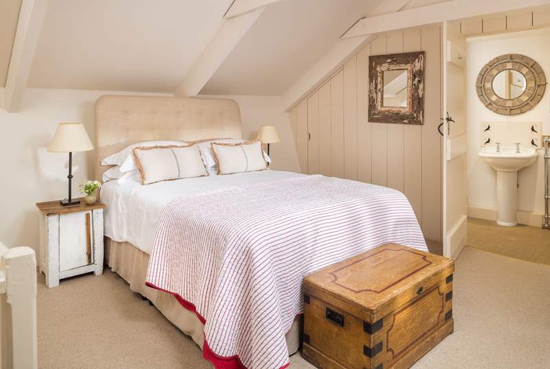 The bedroom has a comfortable king-size bed, perfect for lazy mornings.