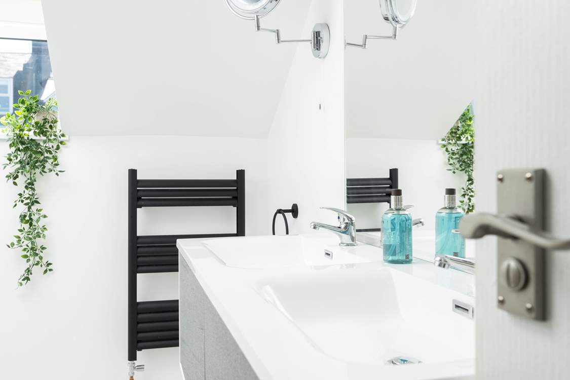 The stylish shower-room is shared by the bedrooms.