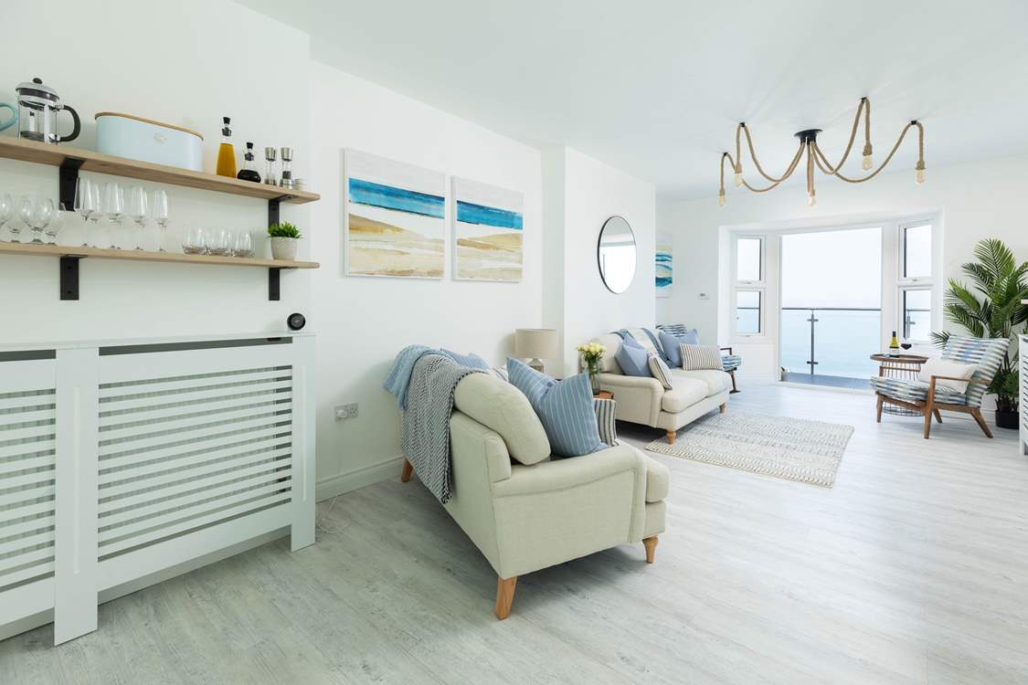 The living area of this open plan room is a tranquil spot to sit and relax.
