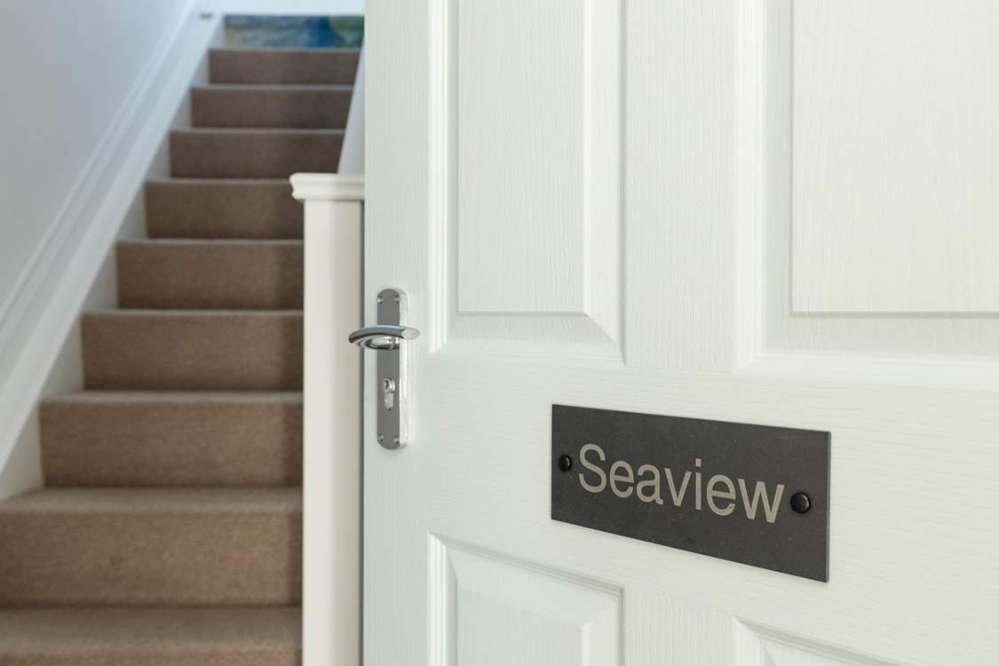 Peeking in through the front door.