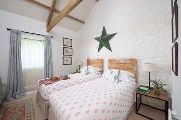 The pretty twin bedded room is located on the ground floor.
