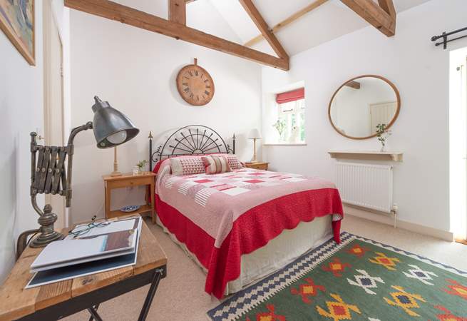 The vaulted ceilings in the bedrooms add to the overall charm and character.