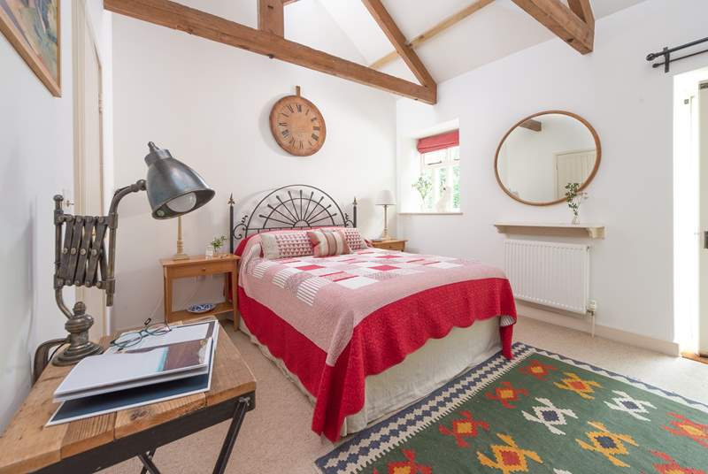 The vaulted ceilings in the bedrooms add to the overall charm and character.