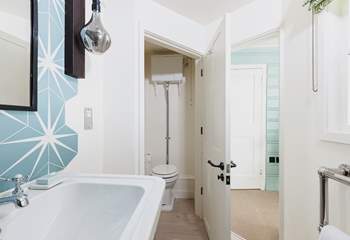 En suite with ingenious double-hinged internal door.