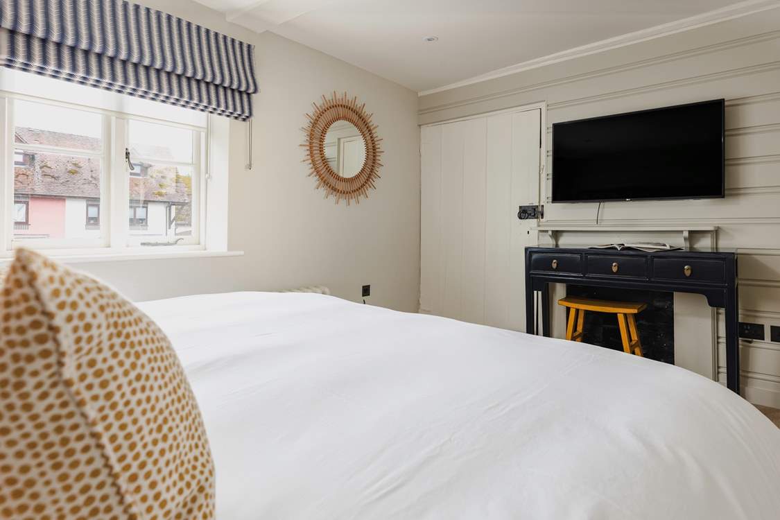 Stay comfy and cosy and watch a film in bed.