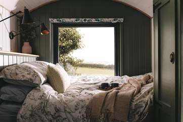 Adorned with luxury linens, the sumptuous king-size bed promises peaceful slumbers.