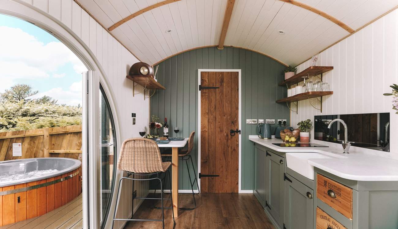Warm wooden tones and deep forest greens create the cosiest space. 