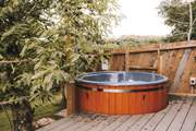 With a secluded wood-fired hot tub - a dreamy spot to unwind.