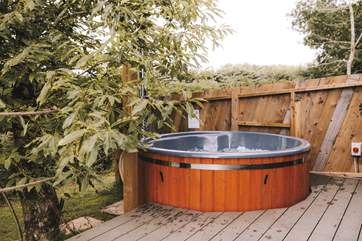 With a secluded wood-fired hot tub - a dreamy spot to unwind.