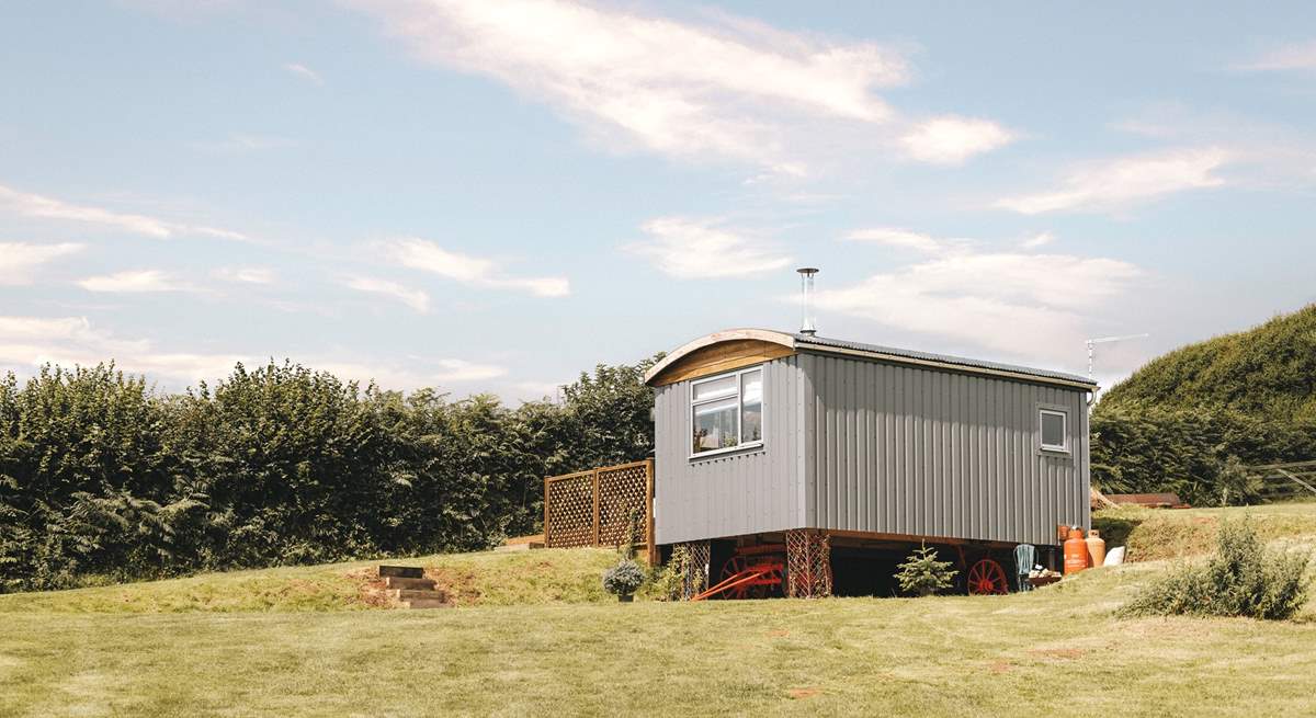 You'll find the hut perched atop a pretty meadow. 