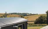 You'll find the hut perched atop a pretty meadow, settled within the gentle rolling hills of rural south Devon. - Thumbnail Image