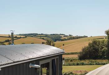 You'll find the hut perched atop a pretty meadow, settled within the gentle rolling hills of rural south Devon.