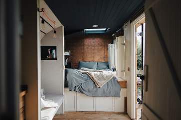 The king-sized bed is perfect for a restful night's sleep.