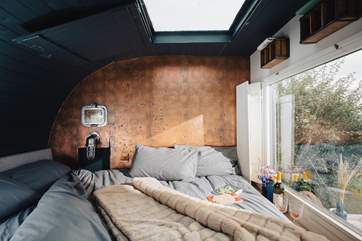 When it's time to rest your head, admire the night sky through the stargazing window.